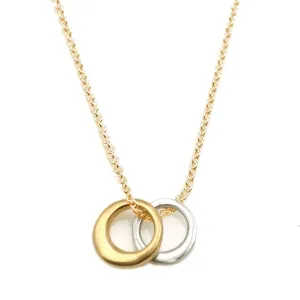 Philippa Roberts necklace with small silver and gold vermeil rings